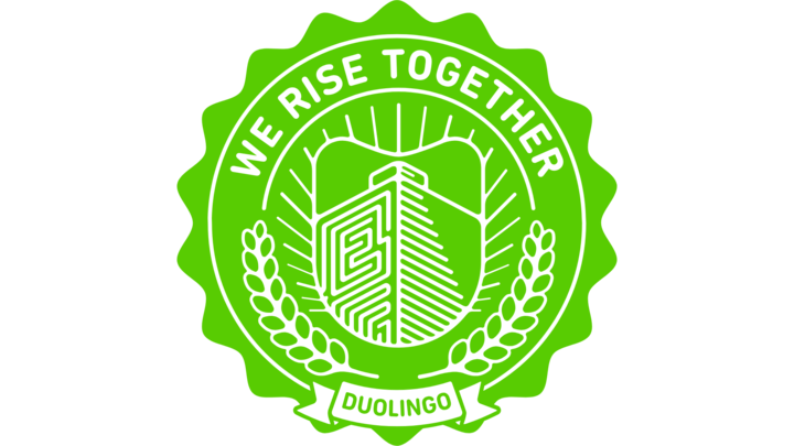 a circular green seal logo, that has the words "we rise together" at the top, "Duolingo" at the bottom, and an owl in the middle.